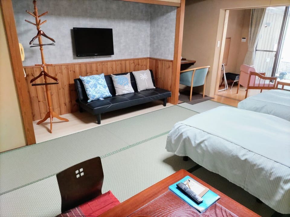 Desk, laptop workspace, free WiFi, bed sheets
