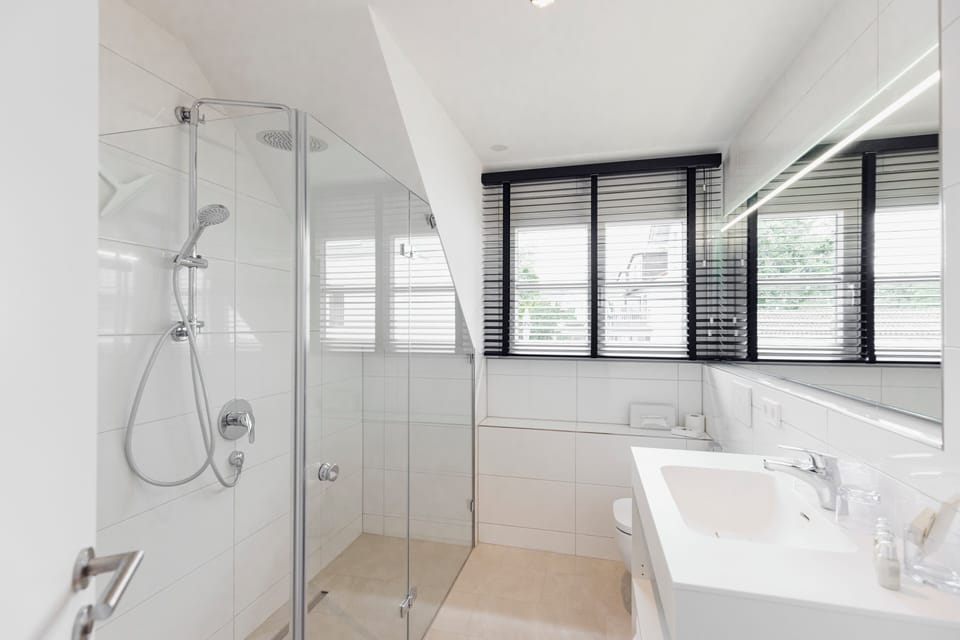 Shower, bathrobes, slippers, towels