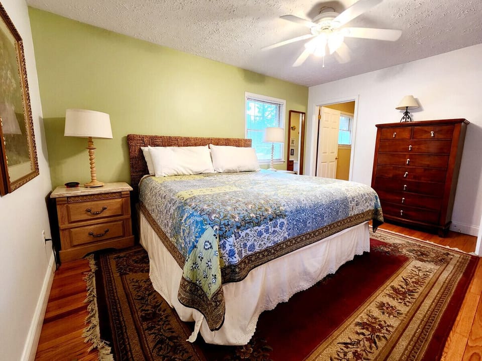 Unwind in the serene master bedroom with a plush king-sized bed and elegant decor.