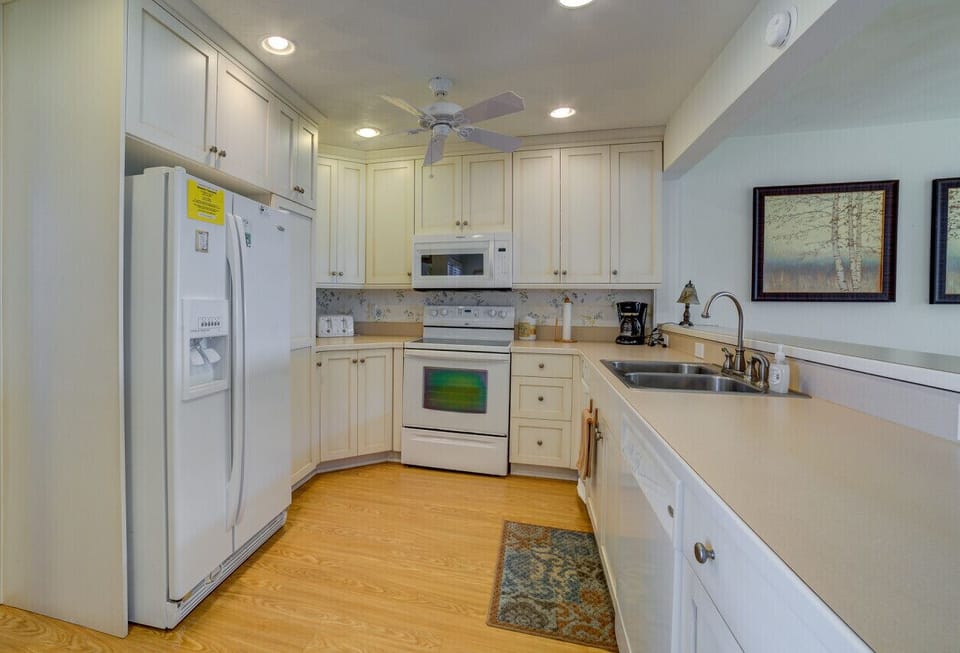 Modern kitchen with essentials for home-cooked meals and gatherings.