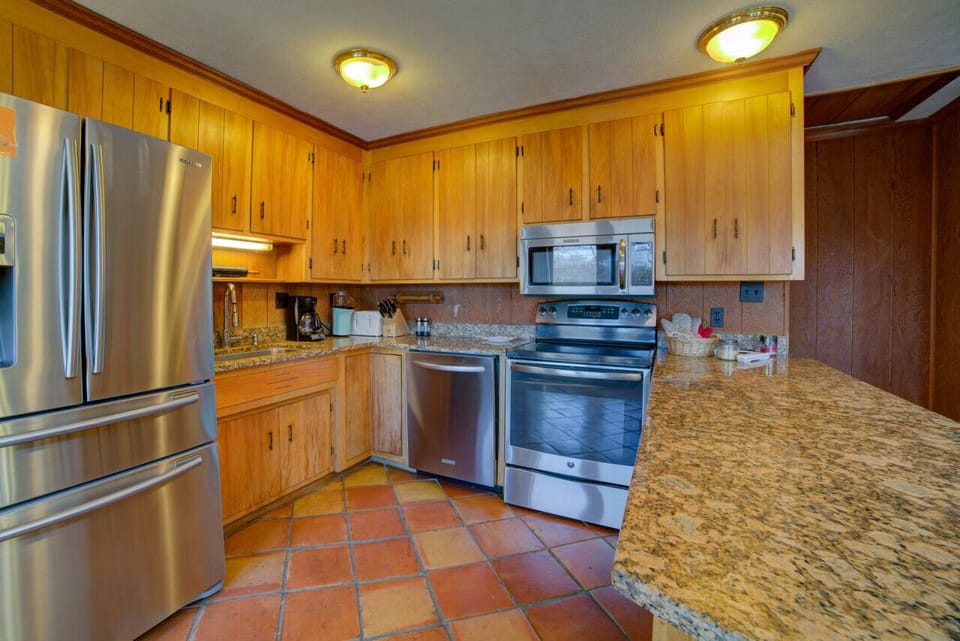 Cozy kitchen with a functional layout and modern amenities perfect for quick meals and gatherings.