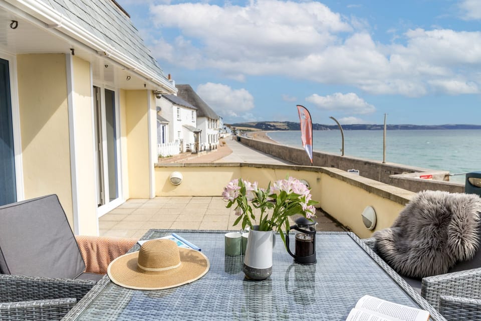 Balcony with ocean view and dining table - 3 At the Beach