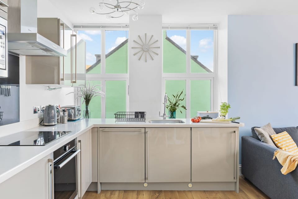 Bright kitchen with dishwasher and coffee machine, family friendly- 10 At The Beach
