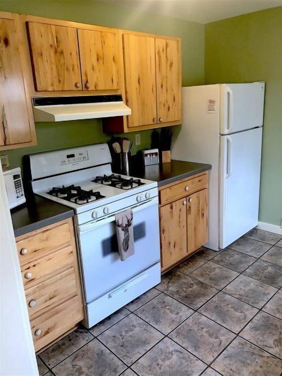 The large kitchen with full size appliances