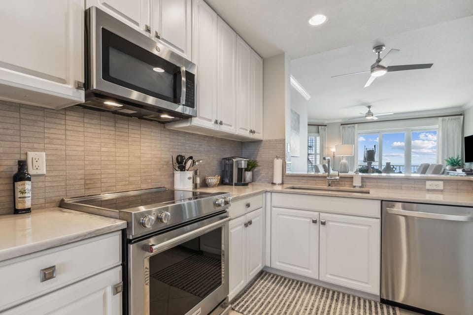 Immaculate Luxury Kitchen Fully Equipped For All Your Cooking Needs-Stainless Steel Appliances, Handsome Granite Countertops, Wine Cooler, and Bar Area