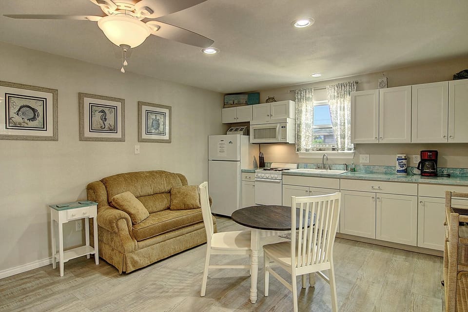 Unwind in your comfortable living space with a fully equipped kitchen, perfect for preparing meals and relaxing after a day of adventure.