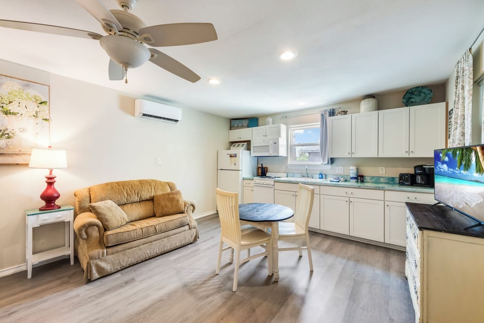 Your bright, open living space combines a full kitchen and cozy seating area—perfect for morning coffee or unwinding after a beach day. A/C and ceiling fan keep you comfortable.
