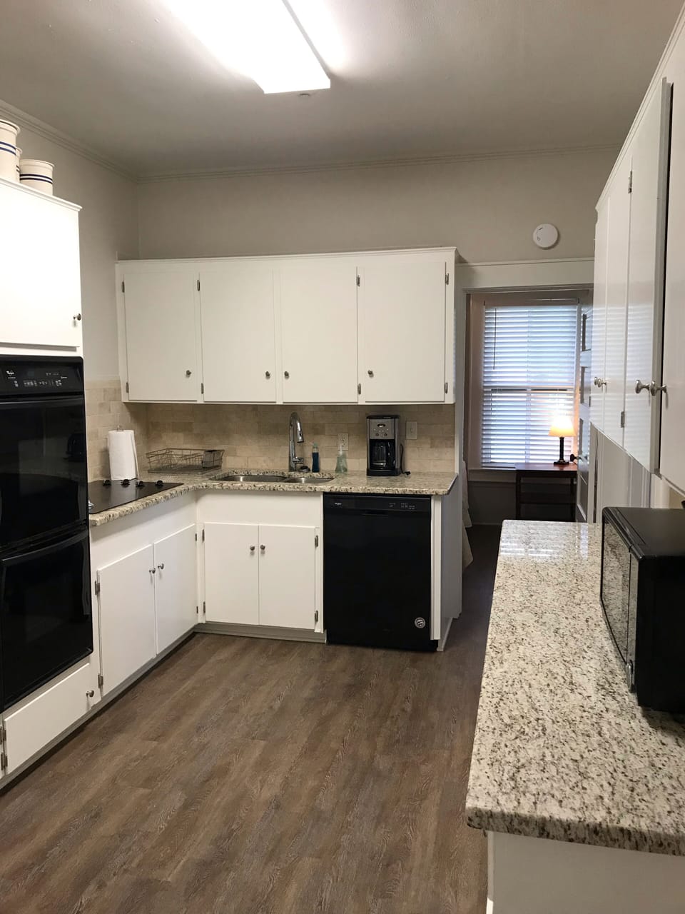 Recently remodeled kitchen with granite countertops! Double oven, range 