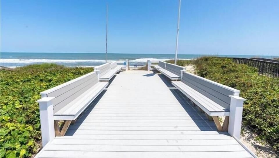Ships Watch Community Beach Walk leads directly to pristine oceanfront shoreline with built-in bench seating along the boardwalk approach.