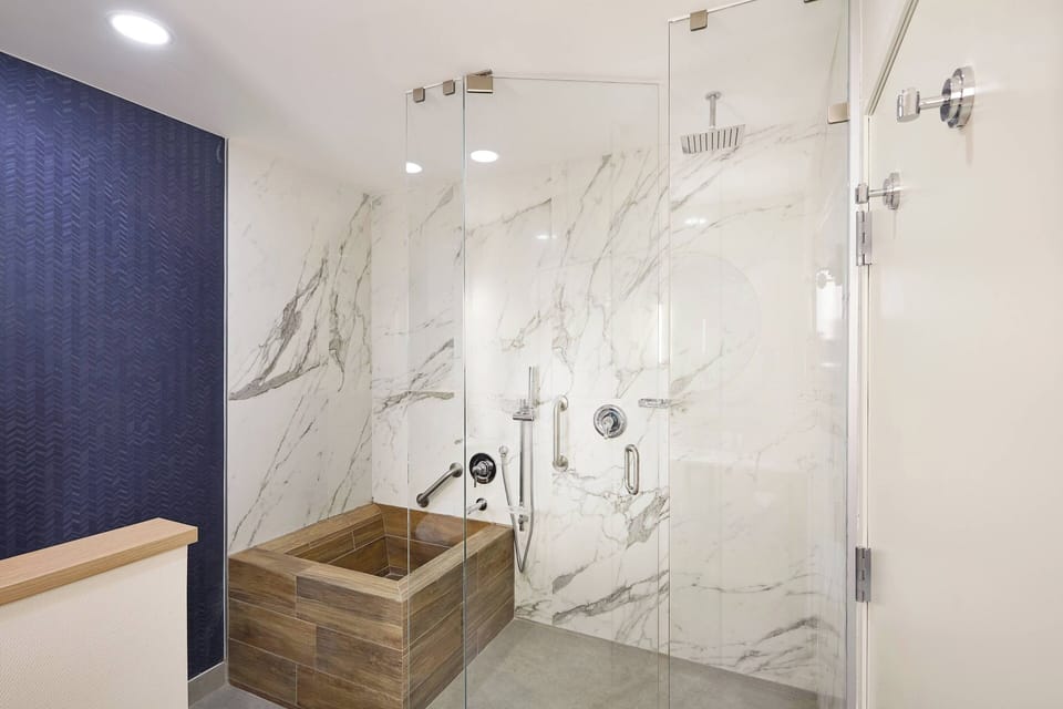 Room, 1 King Bed with Sofa bed, City View | Bathroom | Rainfall showerhead, eco-friendly toiletries, hair dryer, towels
