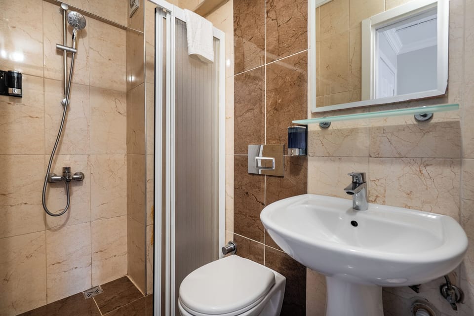 Standard Double Room, 1 Queen Bed, City View | Bathroom | Shower, free toiletries, hair dryer, slippers