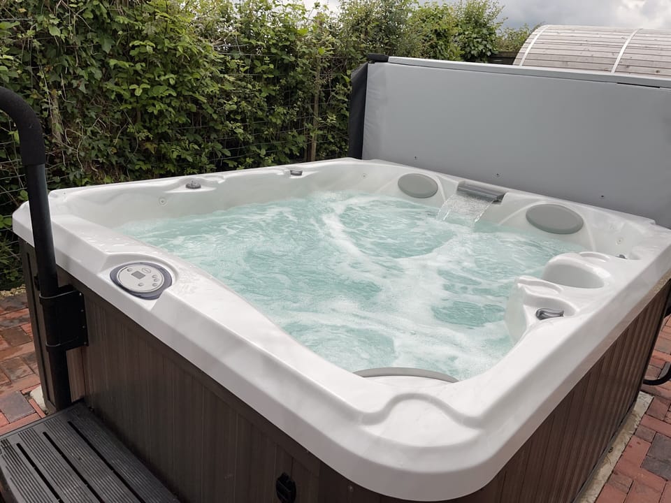 Blackthorn Lodge's own Jacuzzi J225 with jets and waterfall