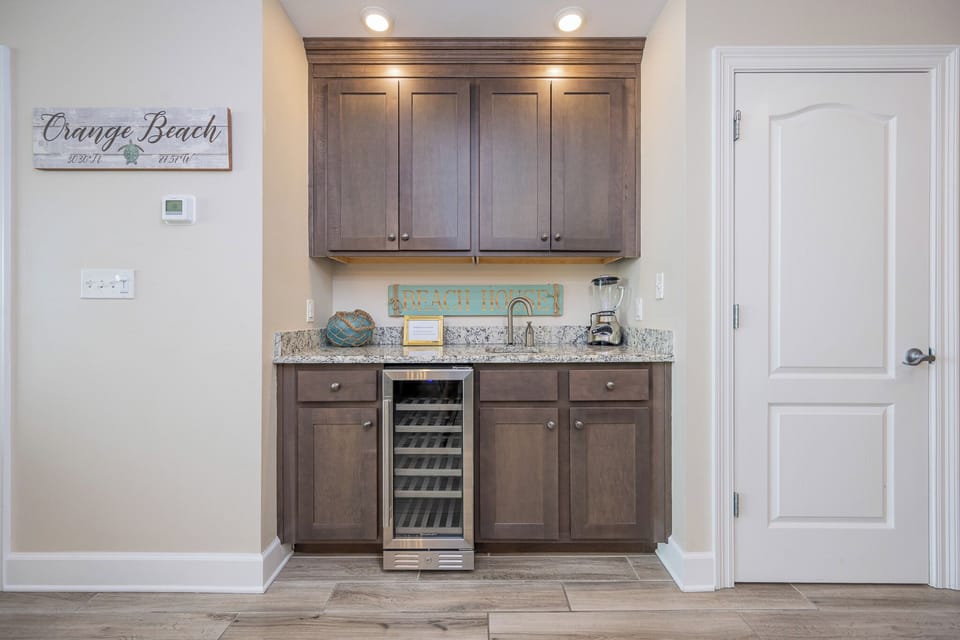 Grab a chilled bottle from the wine cooler or create your favorite cocktail at this elegant wet bar