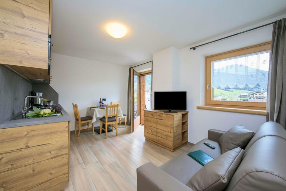 Living room with kitchen and dining area