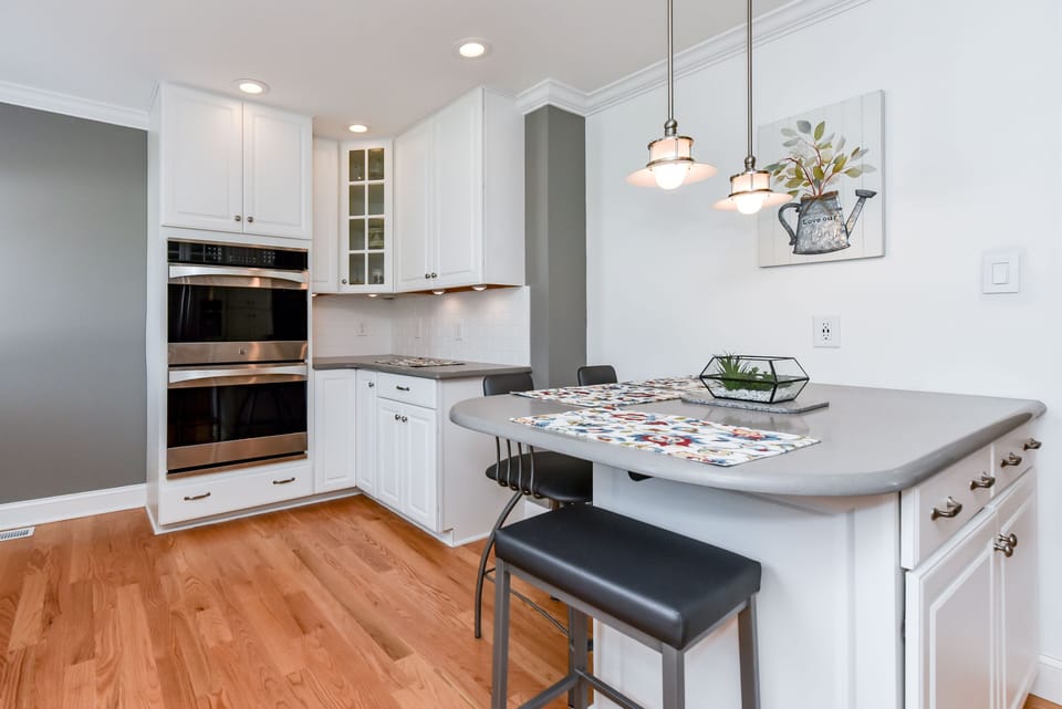 Island seating, coffee bar and double ovens