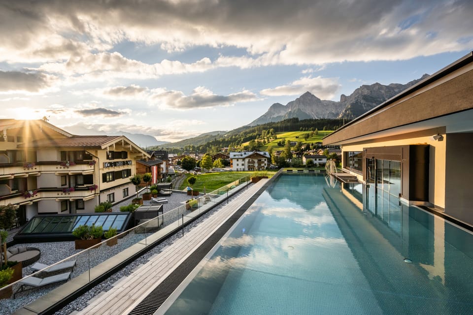 2 indoor pools, 2 outdoor pools, open 7:00 AM to 7:00 PM, pool umbrellas