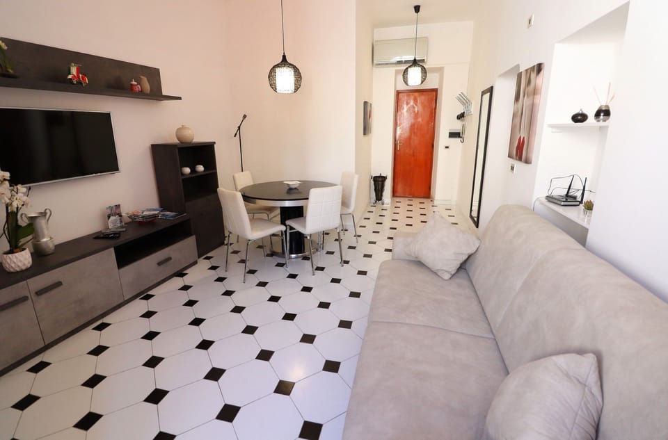 Apartment, 1 Bedroom, Balcony, Beachside | Living room | Flat-screen TV