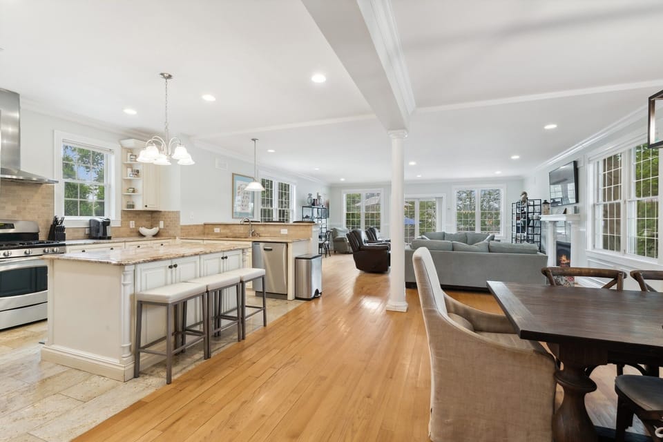 View from main entry showing kitchen on left, dining area on right, great room.