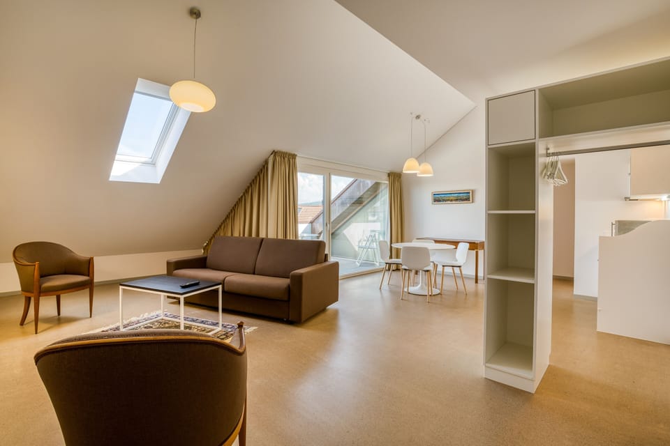 Deluxe Suite, 1 King Bed with Sofa bed, Garden View | Living area | 100-cm flat-screen TV with cable channels, TV, Netflix