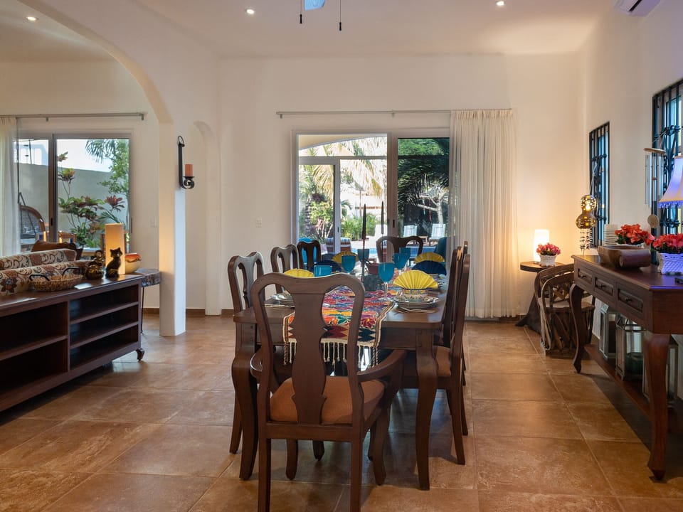 Spacious dining room with a view of the pool - Dining table seats 8.