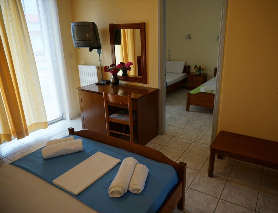 Quadruple Room, Partial Sea View | Laptop workspace, blackout drapes, free WiFi, bed sheets