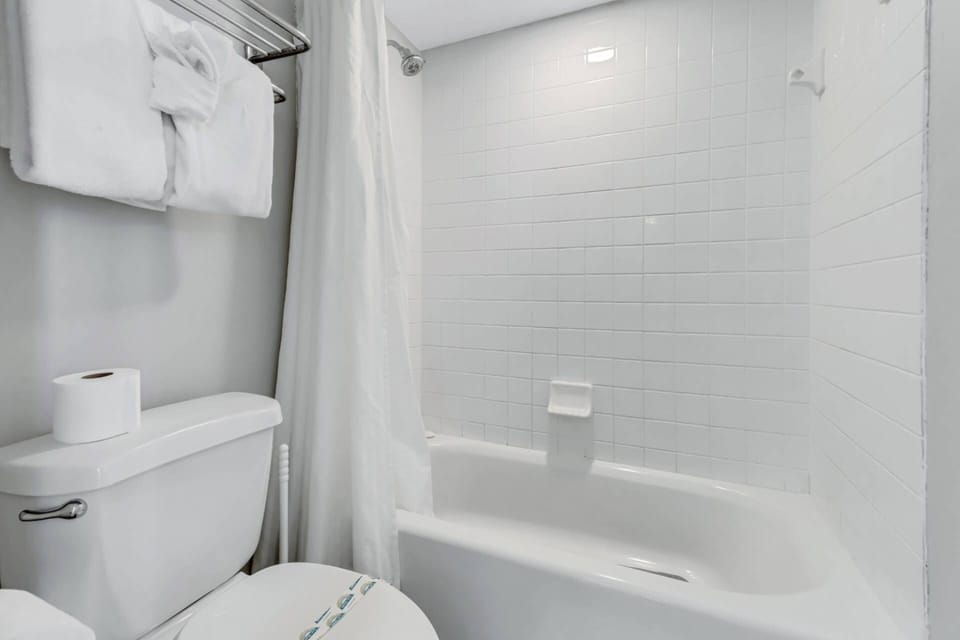 Master bath with tub/shower combination.