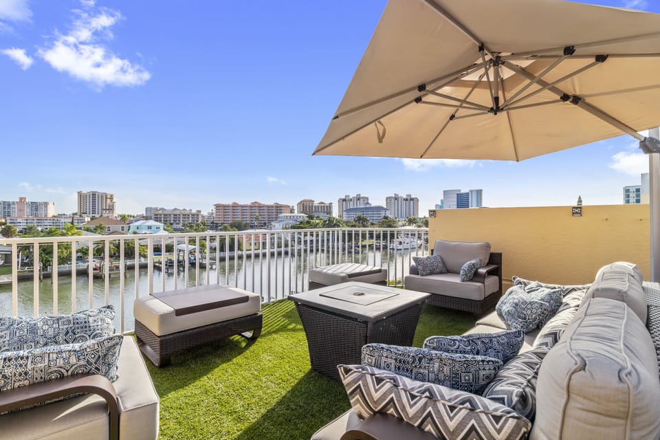 Rooftop has plenty of seating, 2 fire pits, and a large 11' cantilever umbrella