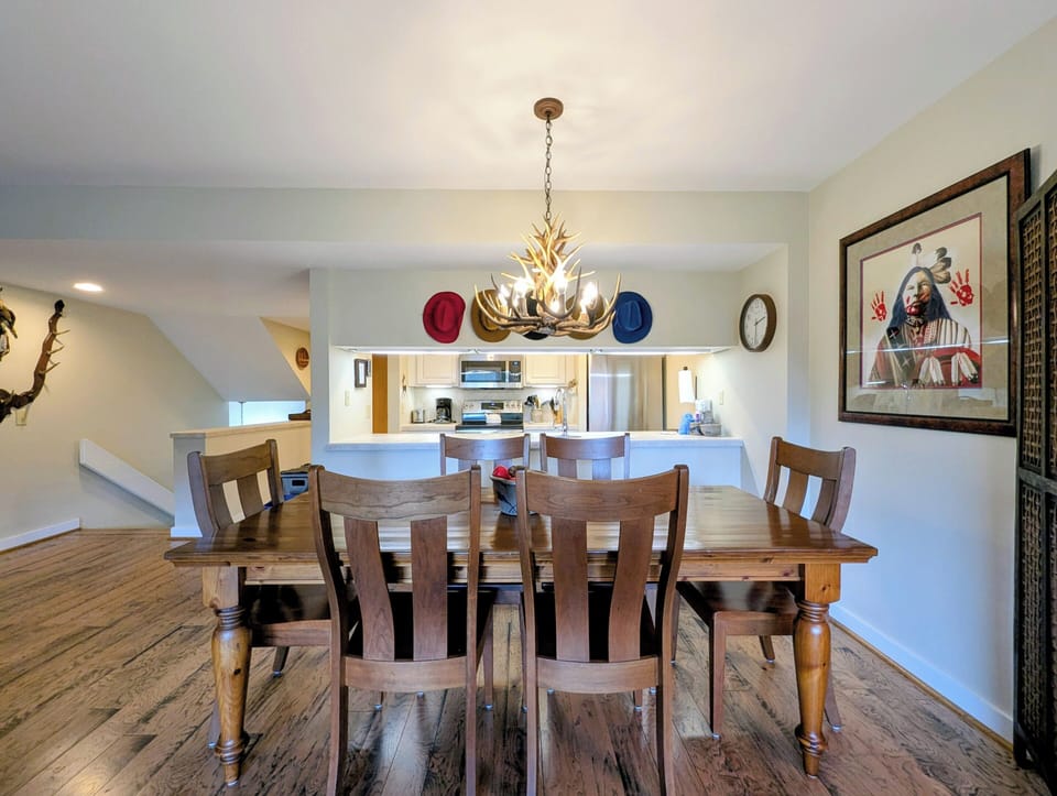 Gather around this welcoming dining space where rustic charm meets modern comfort, perfect for sharing meals and making memories with your group.