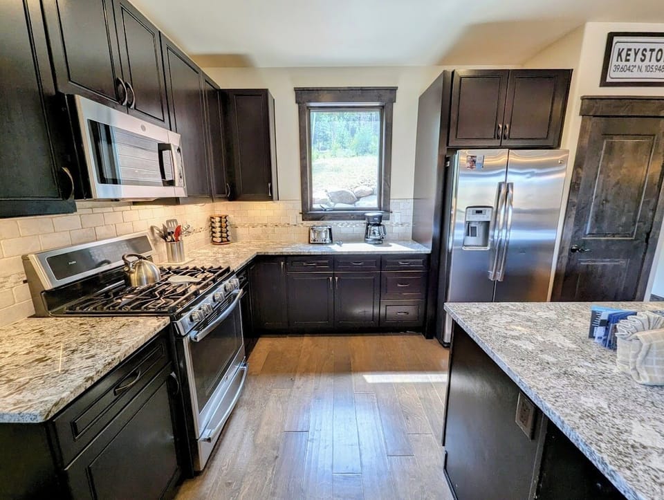 Stainless appliances and stone countertops