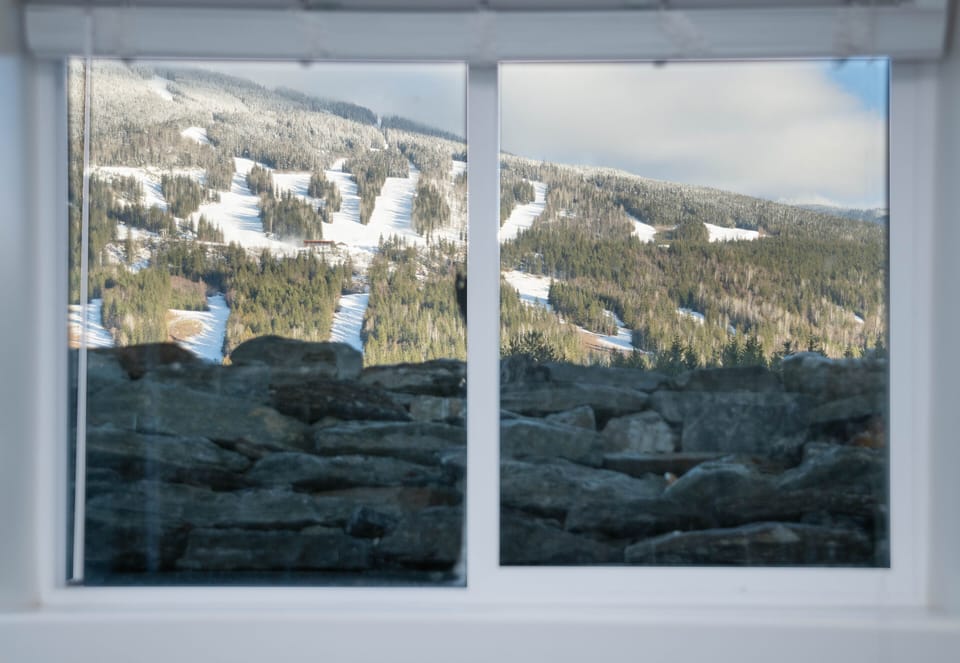 View of Revelstoke Mountain Resort from bed in the (Queen) Mackenzie Room