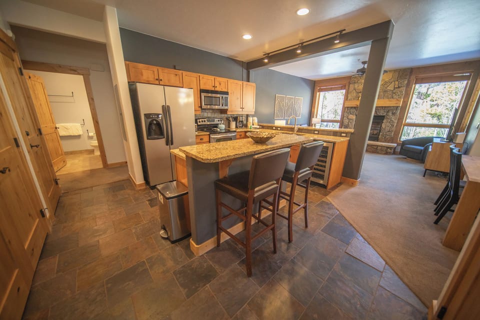 Fully equipped kitchen with bar stool seating