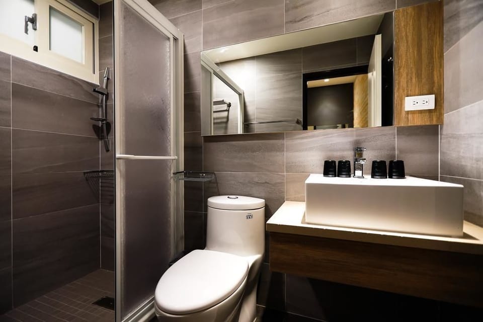 Quadruple Room, Non Smoking, Balcony (202) | Bathroom | Shower, rainfall showerhead, free toiletries, hair dryer