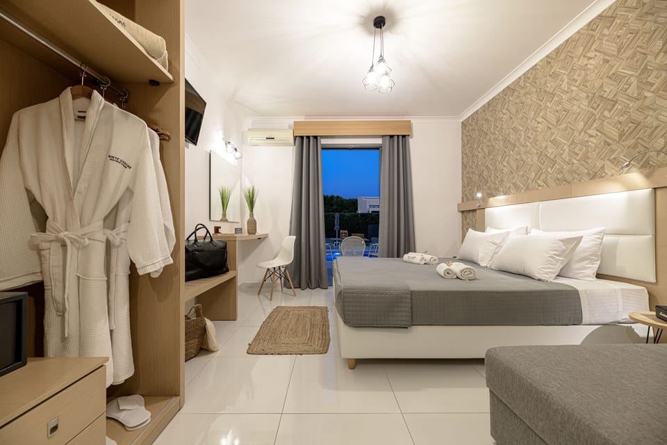 Deluxe Studio, Pool View | In-room safe, blackout drapes, iron/ironing board, free WiFi