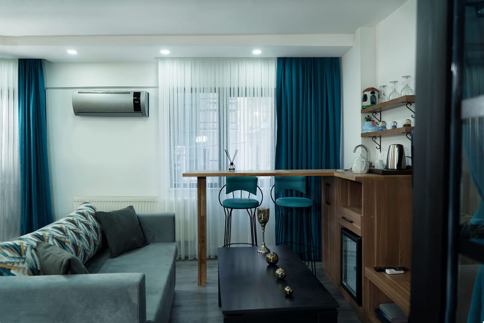 Deluxe Double Room, City View | Living area | LCD TV, first-run movies