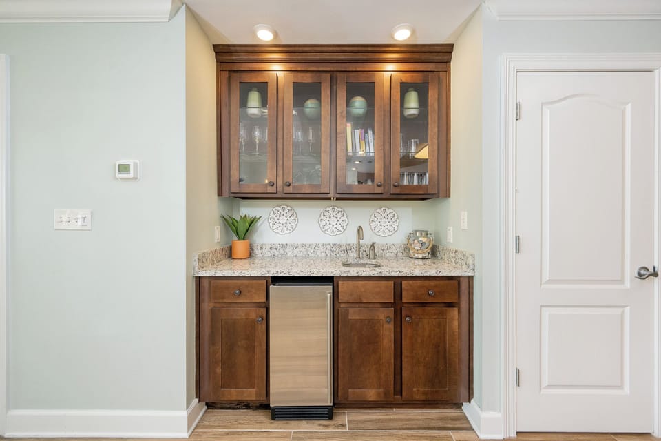 Mix refreshing drinks or snacks at the sleek wet bar, enhancing your leisurely evenings after a day on the coast