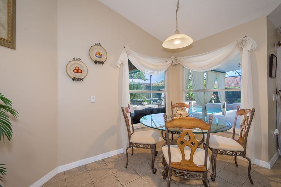 Enjoy breakfast with relaxing views of the pool.
