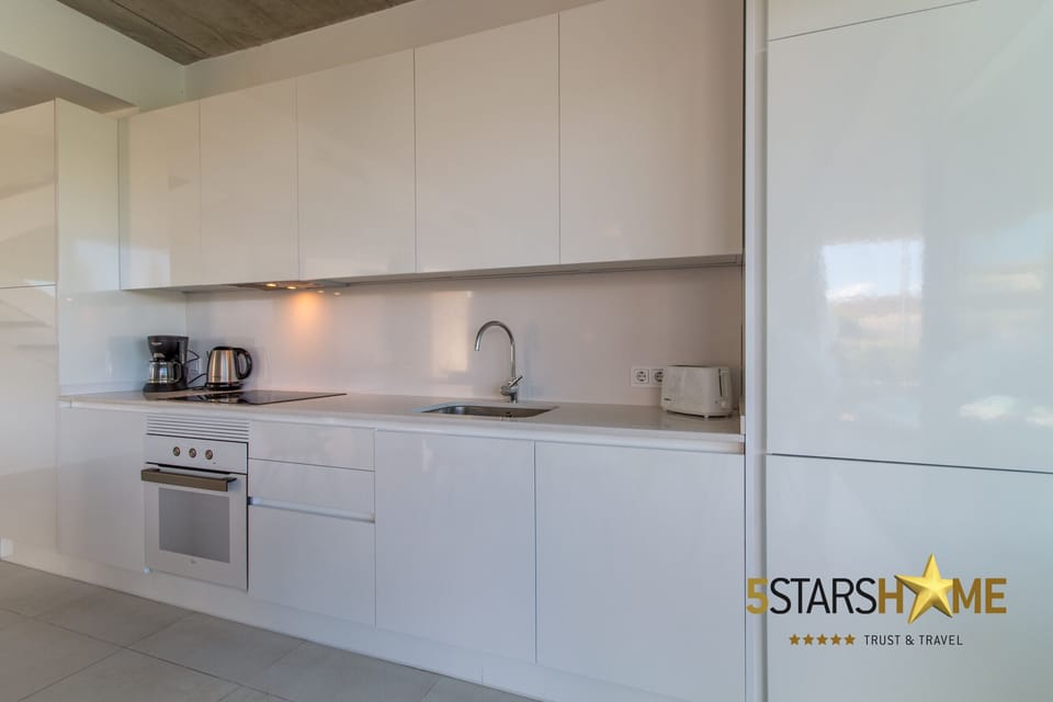 Fully equipped open kitchen with large dining table