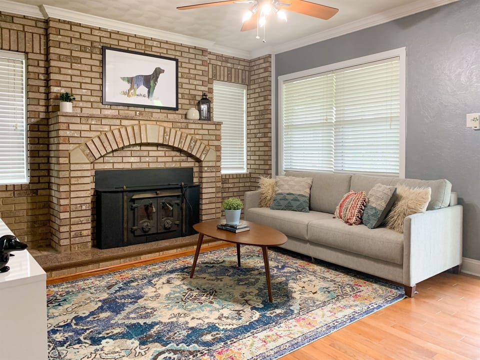 Bright and airy main level living area with smart TV and king sleeper sofa at Setter Haus.