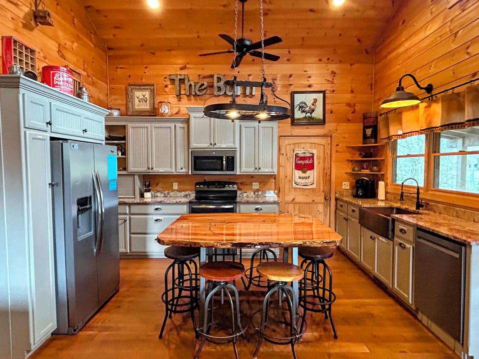 Fully stocked kitchen has everything you need! Custom dining table seats 8.
