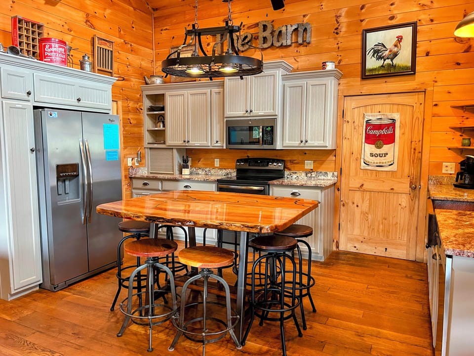 Fully stocked kitchen has everything you need! Custom dining table seats 8.