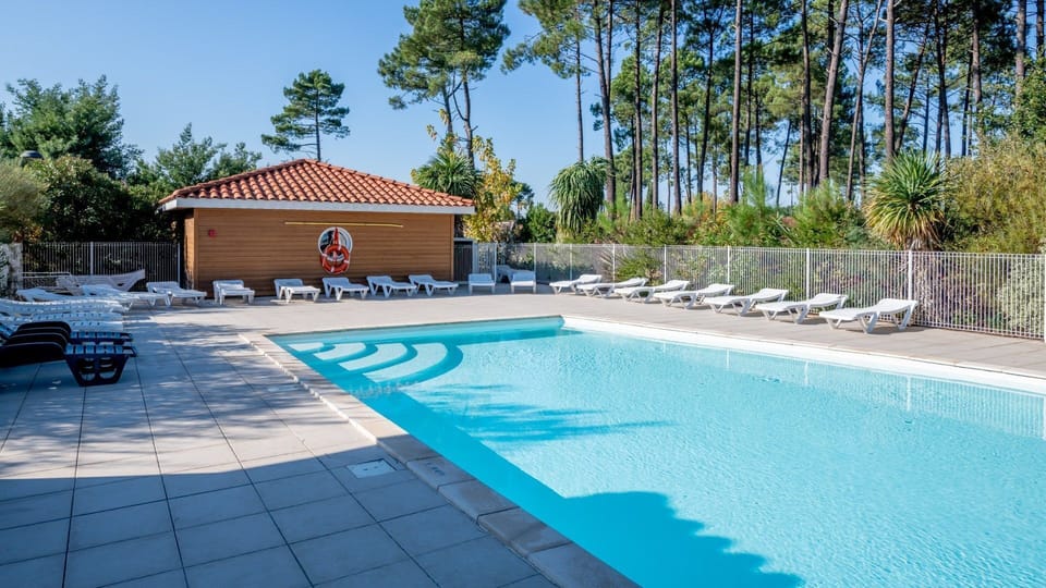 Lounge by the pool in the sunshine.