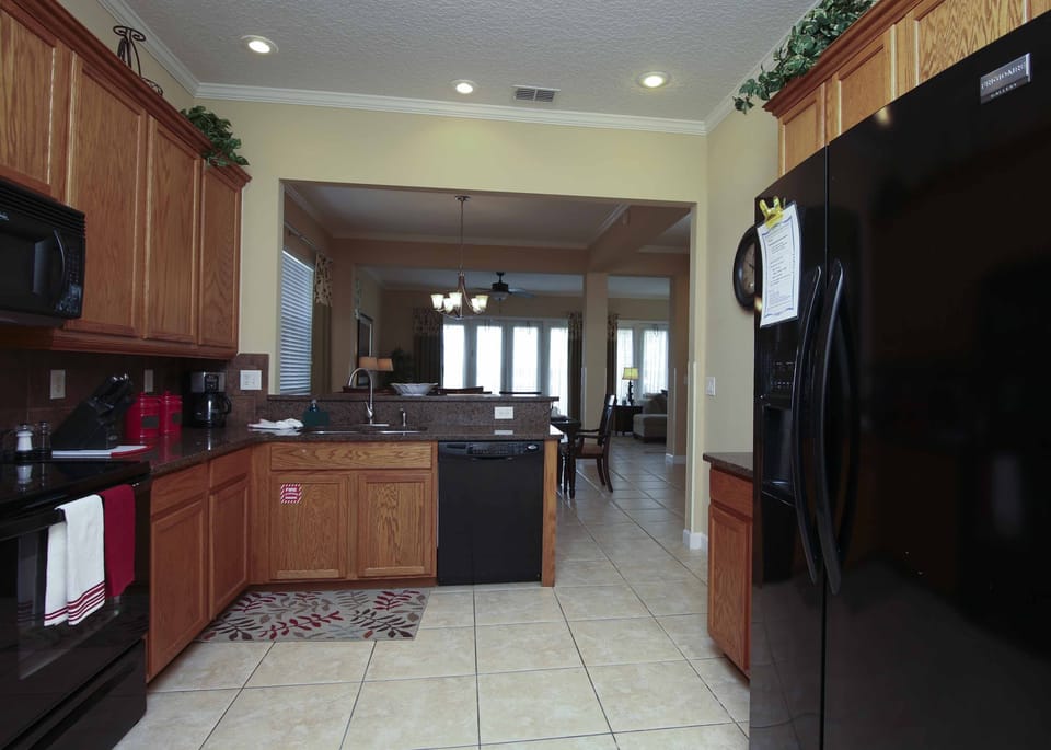 Full Kitchen view to family room and pool