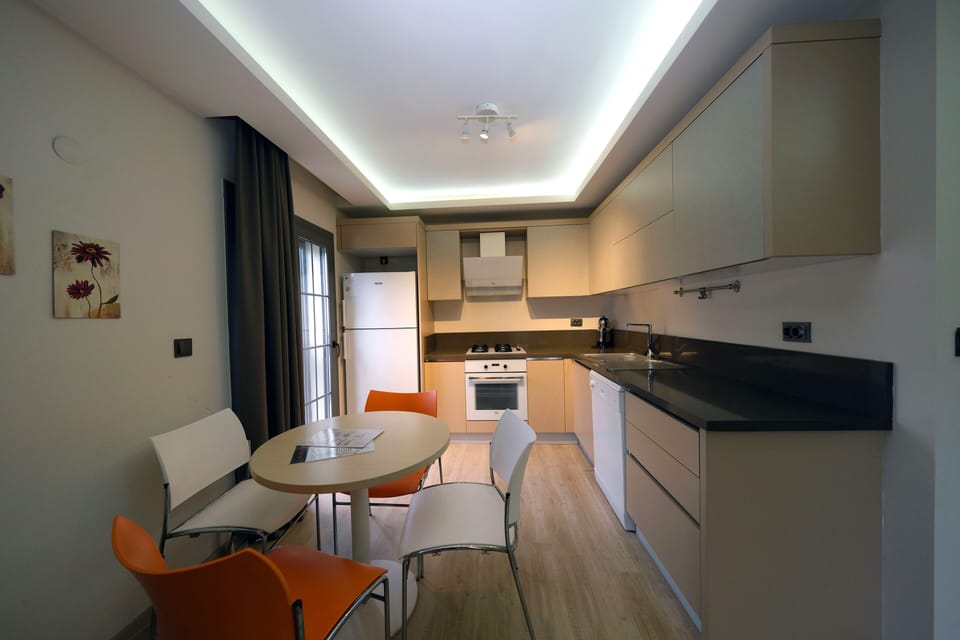 Apartment | Private kitchen | Fridge, coffee/tea maker, highchair