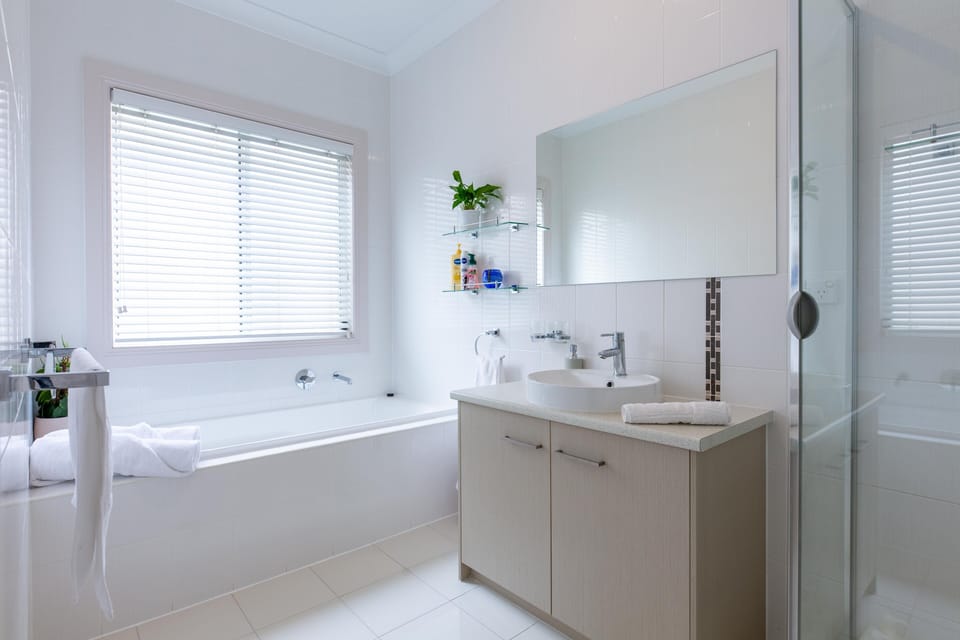 Downstairs bathroom with bath tub