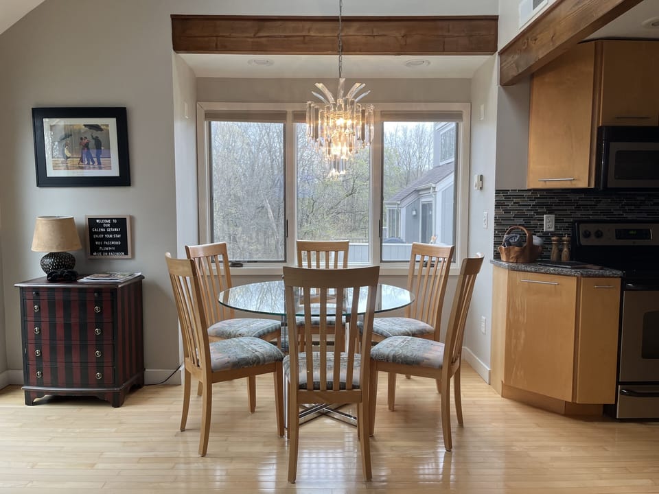 Elegant, round, glass dining table for 6