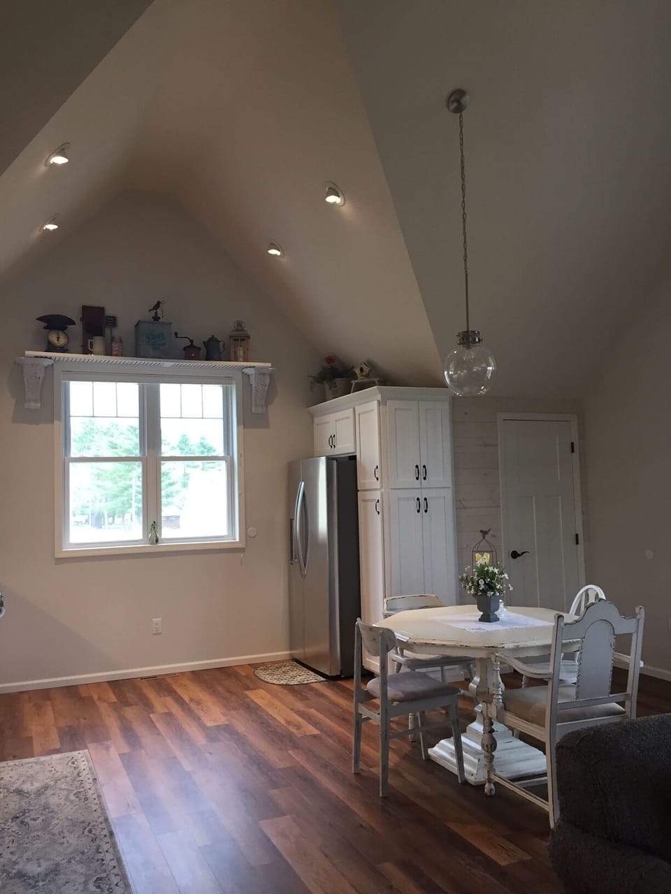 Kitchen with full-size refrigerator and pantry.  

