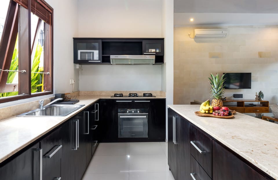 kitchen with stove, microwave and ove