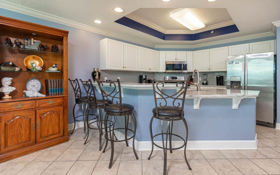 Gather around the stylish bar seating in the kitchen, perfect for casual meals and conversations