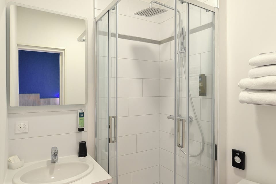 Shower, eco-friendly toiletries, hair dryer, towels