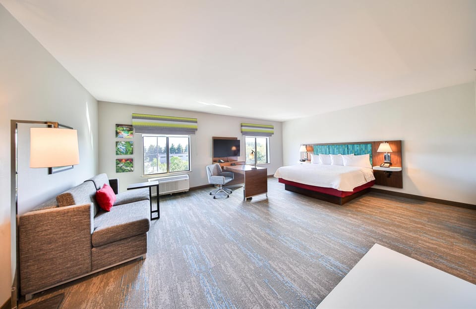 Studio Suite, One King Bed, Non-Smoking | Living area | 55-inch LED TV with cable channels